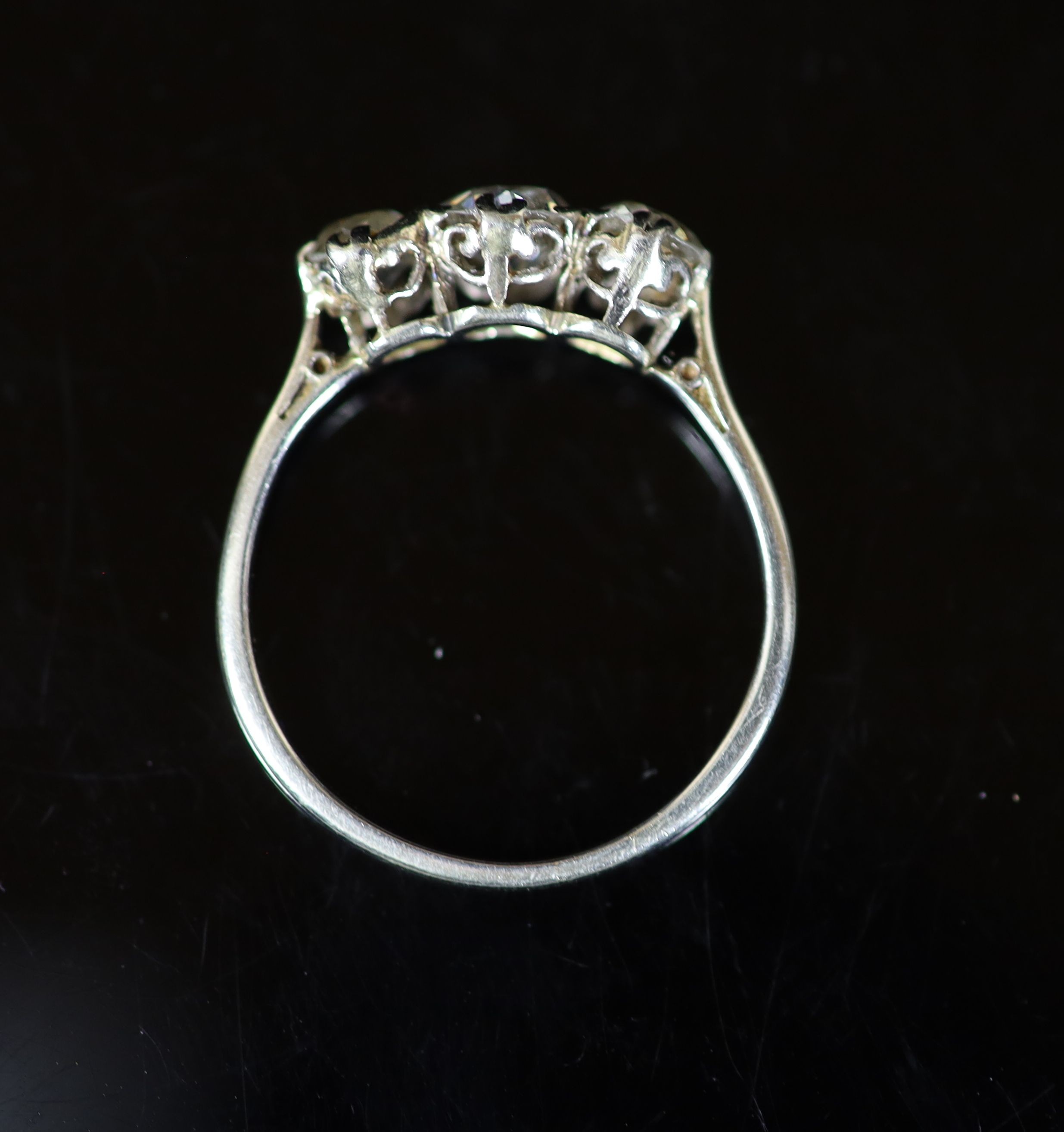 A white gold and three stone diamond set ring